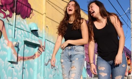 Two young women laughing