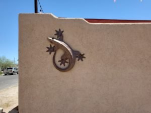 lizard sculpture on wall
