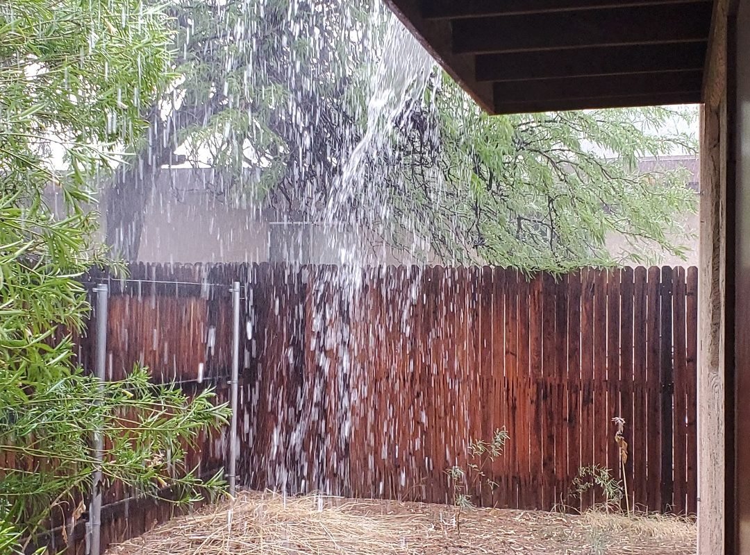 monsoon rainfall sheeting off roof Tucson