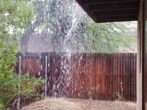 monsoon rainfall sheeting off roof Tucson