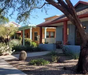 Territorial style homes facing walkway Tucson