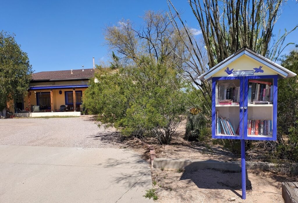 Little Free Library with blue birds of happiness in MidTown Tucson