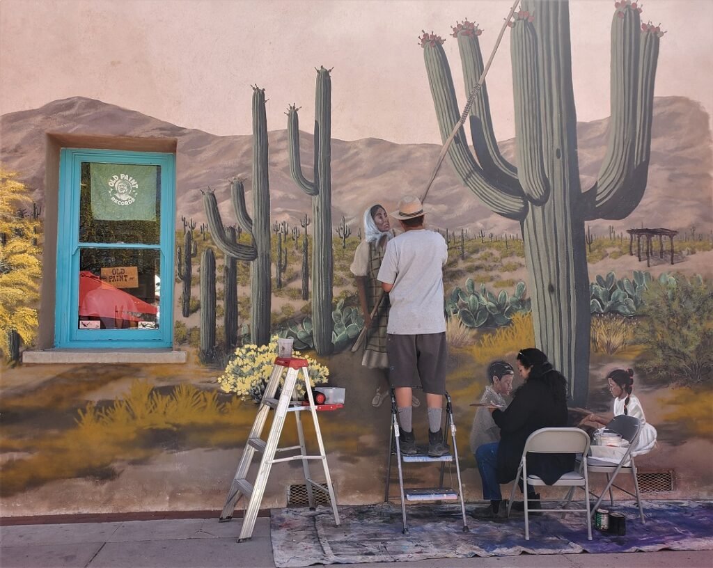 muralists at work at Old Town Artisans Tucson