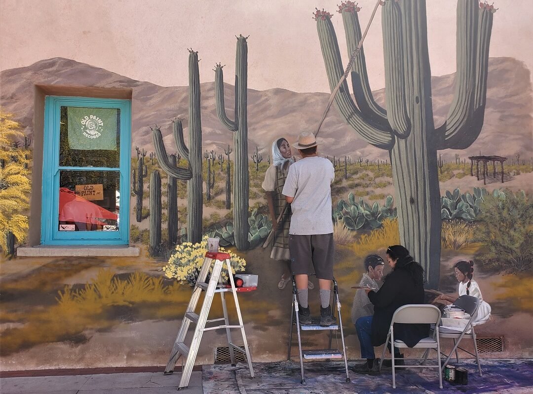 muralists at work at Old Town Artisans Tucson