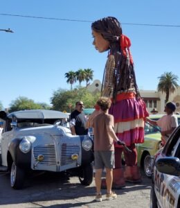 Amal the puppet greeted by lowriders in Tucson