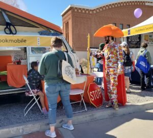 cxowboy librarian with orange hat at Tucson FEstival of Books 2024