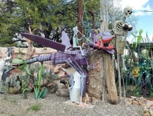 purple dragon-like sculpture in Tucson yard