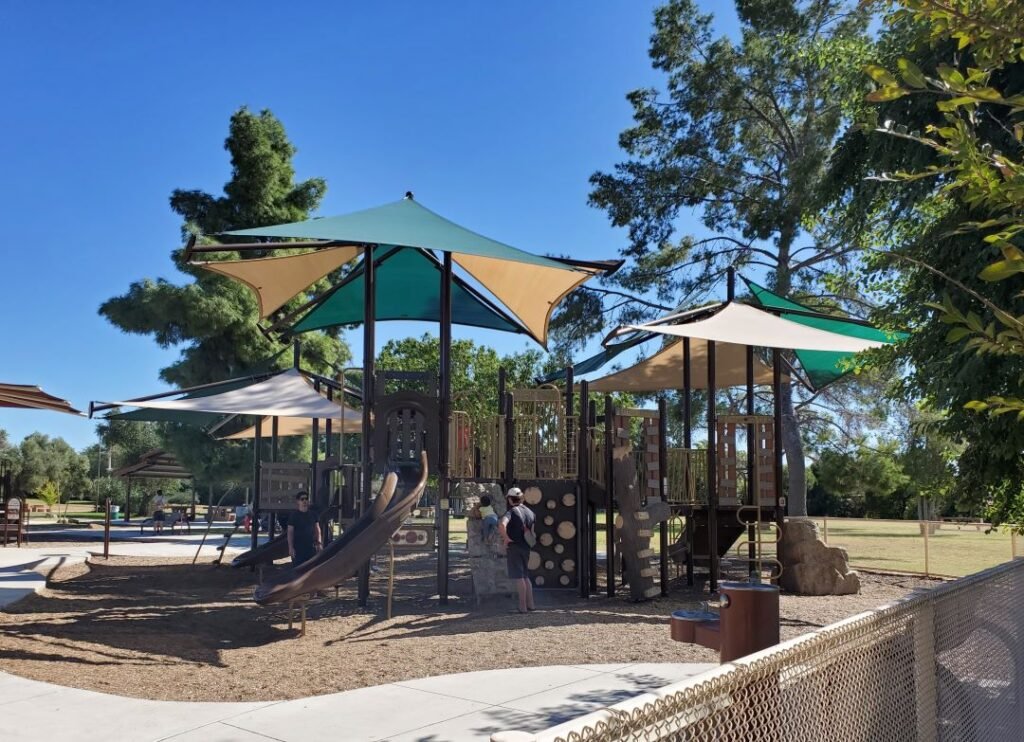playground structure with umbrella for shade