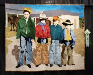 quilt portrait of children wearing cowboy clothes