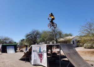 young boy on BMX ramp with bicycle Tucson Cyclovia 2025