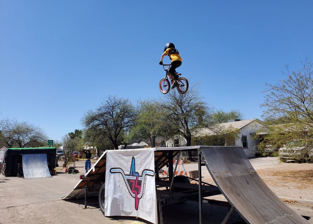 young boy on BMX ramp with bicycle Tucson Cyclovia 2025