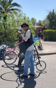 man on penny farthing bicyle
