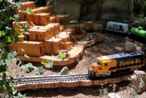 Santa Fe model train with Taos Pueblo model beside it