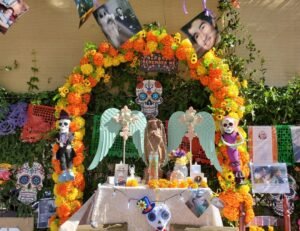 dia de los muertos altar with arch of marigold and two angels