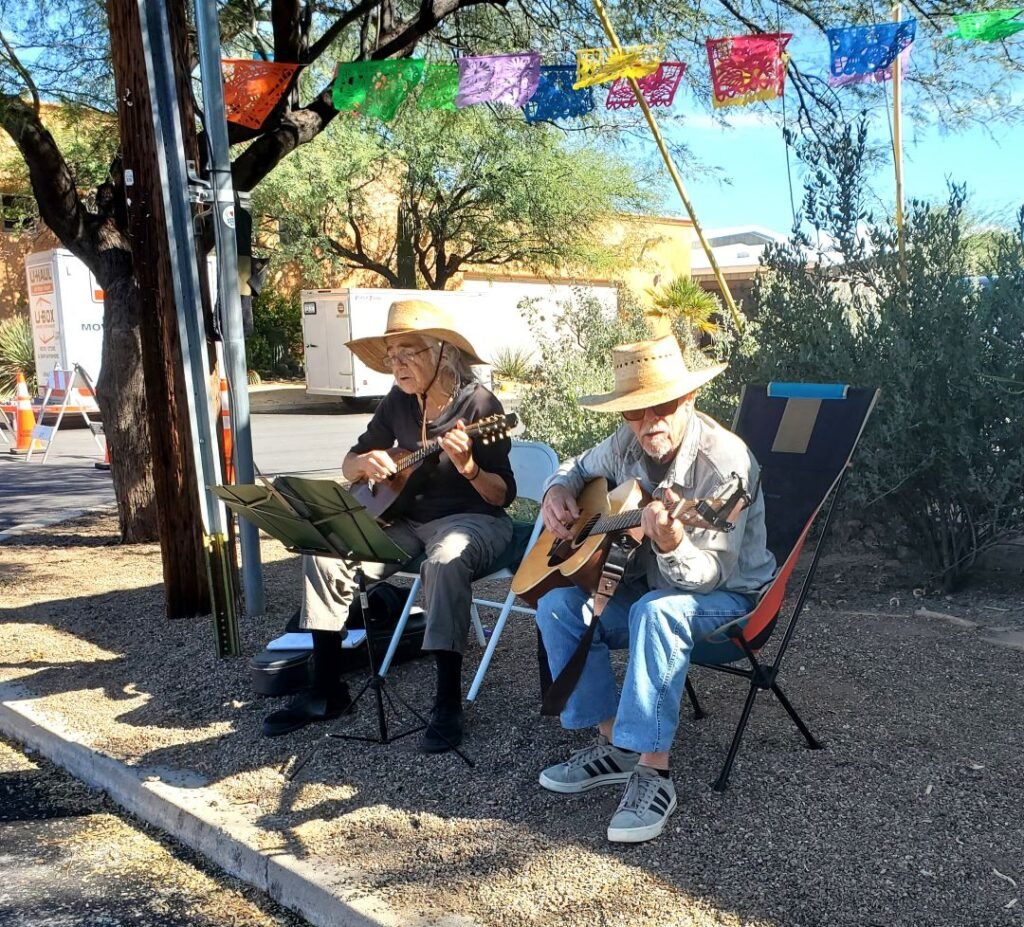 coule singing religious songs on street corner in Tucson